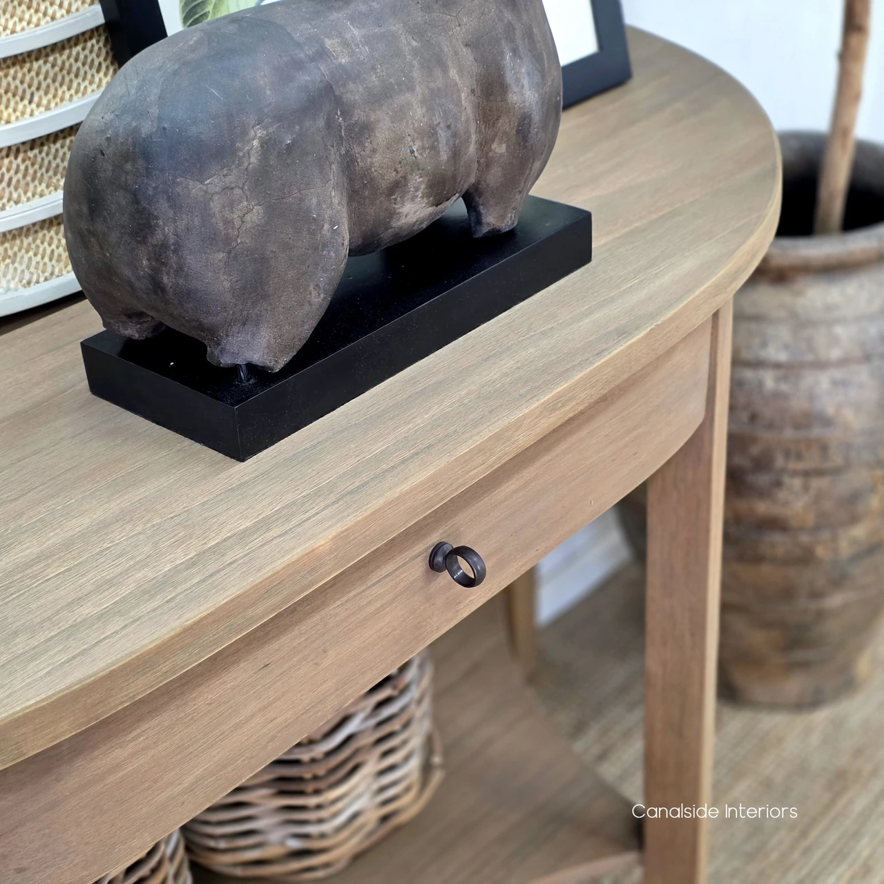 Close-up of the Luna Demilune Console Table showcasing its natural timber grain and beautifully curved tabletop edge.