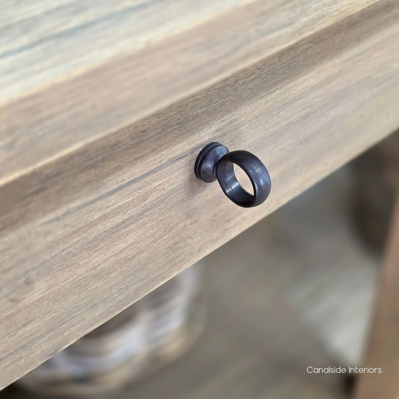 Luna Console Table detail highlighting the central storage drawer and contrasting dark round drawer knob.