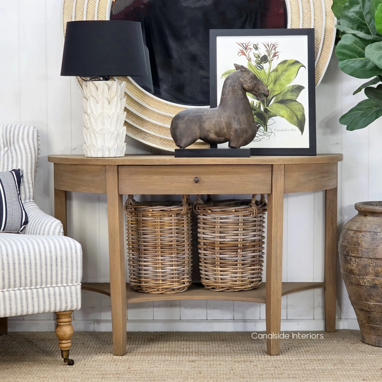 Luna Timber Console Table highlighting its sculptural curved silhouette, refined detailing and spacious lower storage shelf.