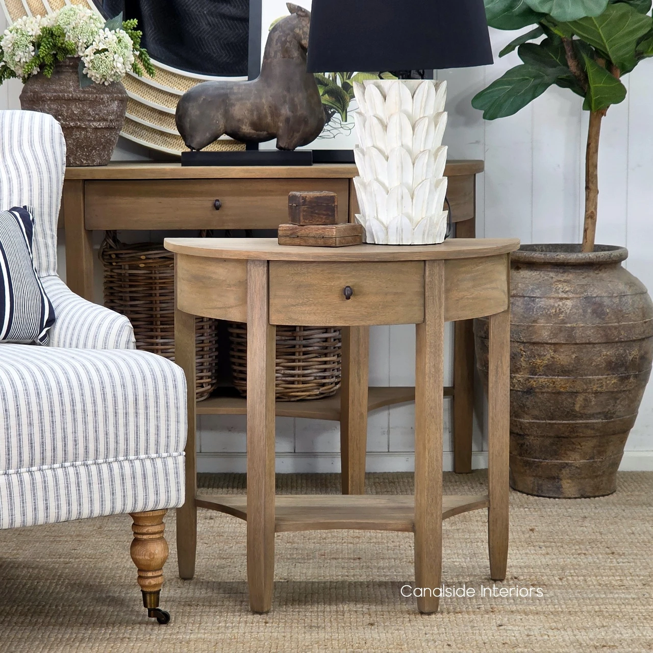 Natural Wood Side Table with Drawer highlighting its graceful curves and versatile design for living rooms.
