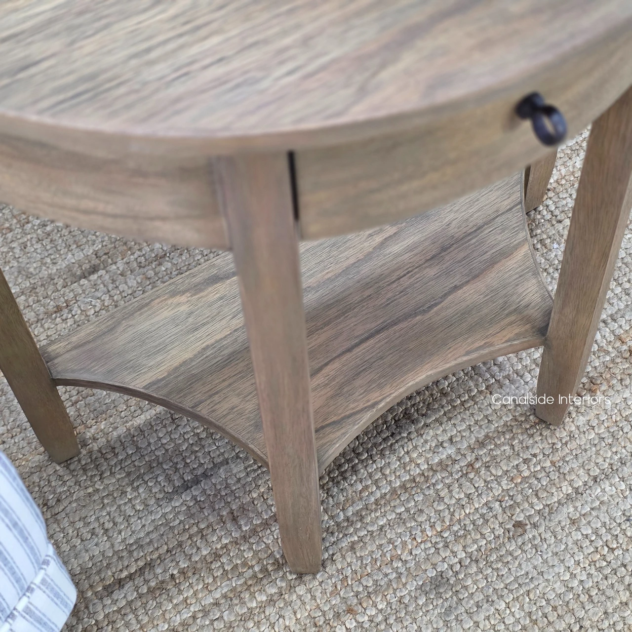 Detailed view of the Luna Demilune Side Table central drawer and decorative dark timber-look knob.