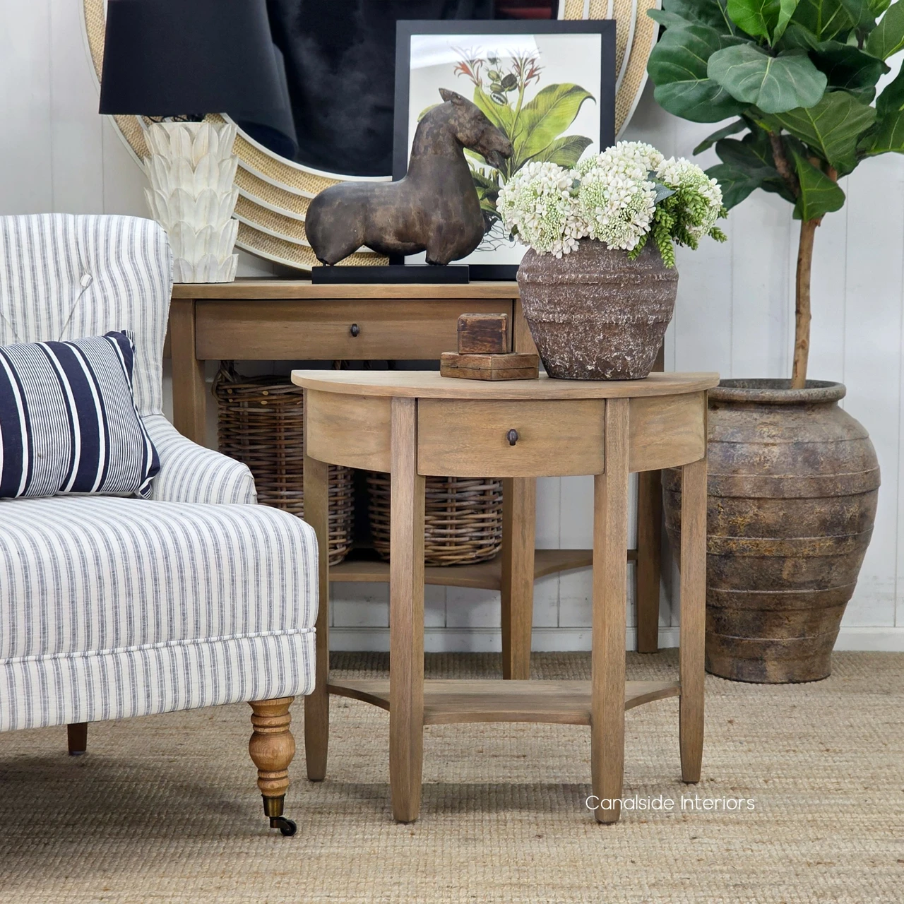 Front view of the Luna Demilune Side Table showcasing its half-moon design and practical central drawer.