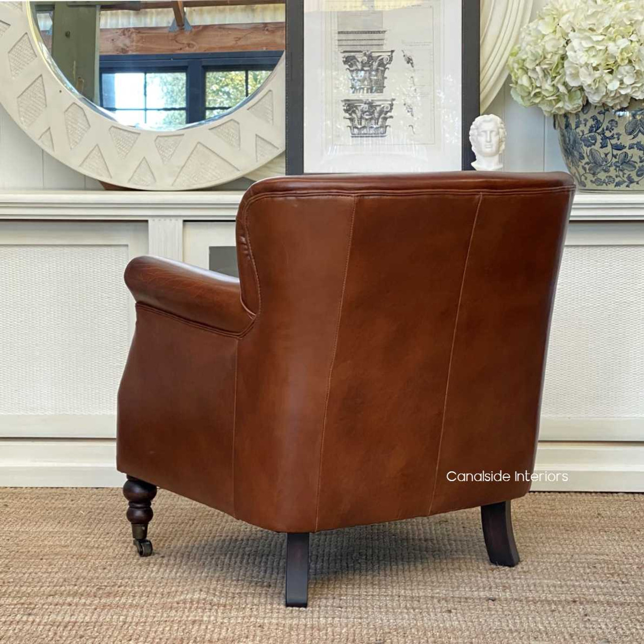 Elevate your interior with this aged leather armchair from Doctus, crafted for those who appreciate timeless design and quality