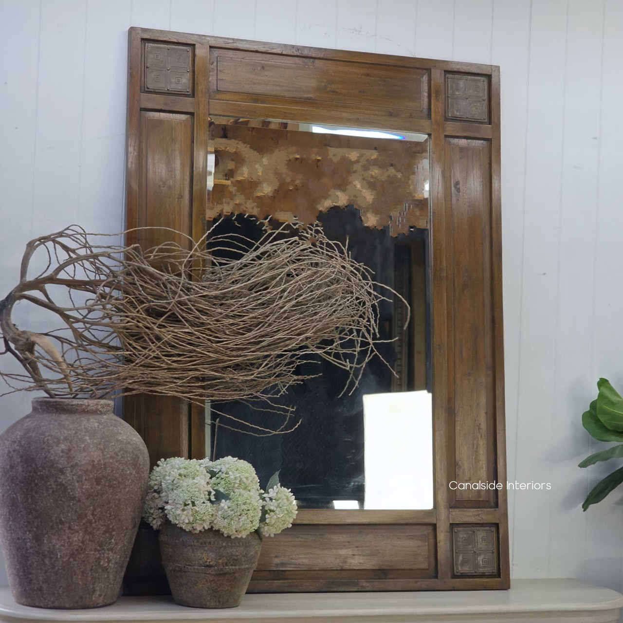 Angled view of the Oh Somh Mirror showcasing its rich timber frame and artisan detailing.