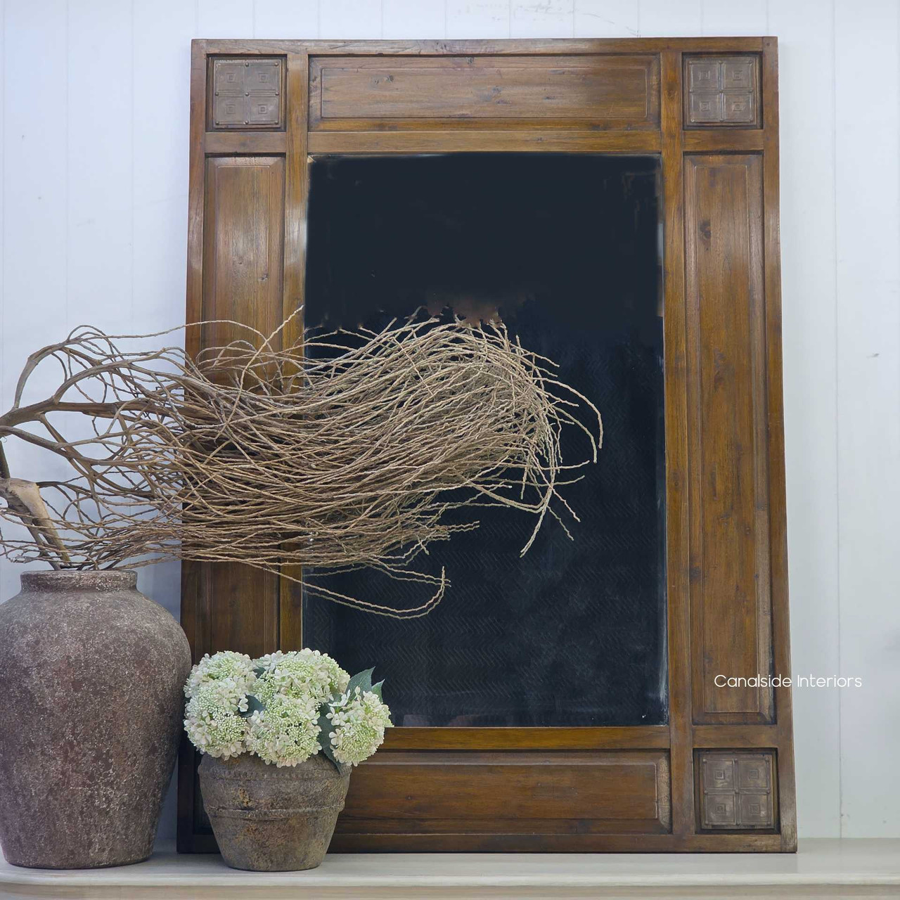 Straight-on view of the Oh Somh Mirror showcasing its tall wooden frame and handcrafted decorative panels.