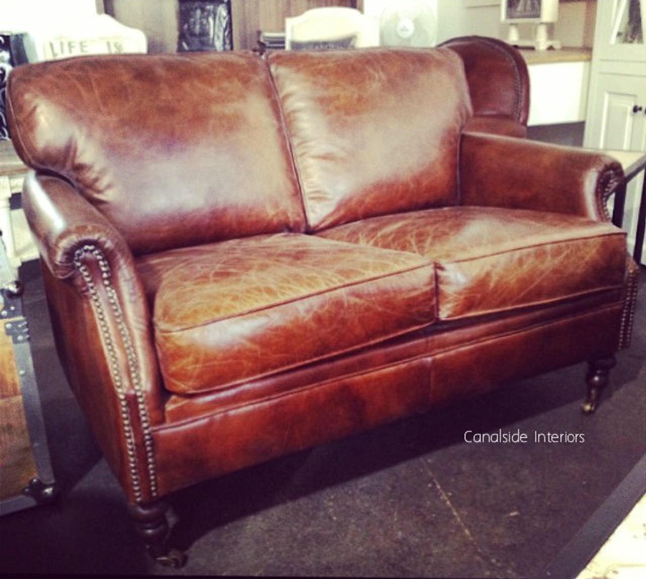 Classical design meets coastal comfort in this aged leather 2 Seater, a must-have for any premium lounge room