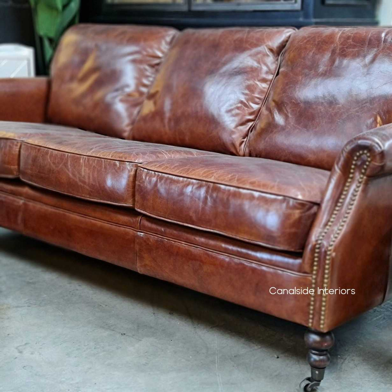 Canalside Interiors presents the Newport Sofa in rich brown, blending classical comfort with modern coastal design for the perfect lounge room experience.