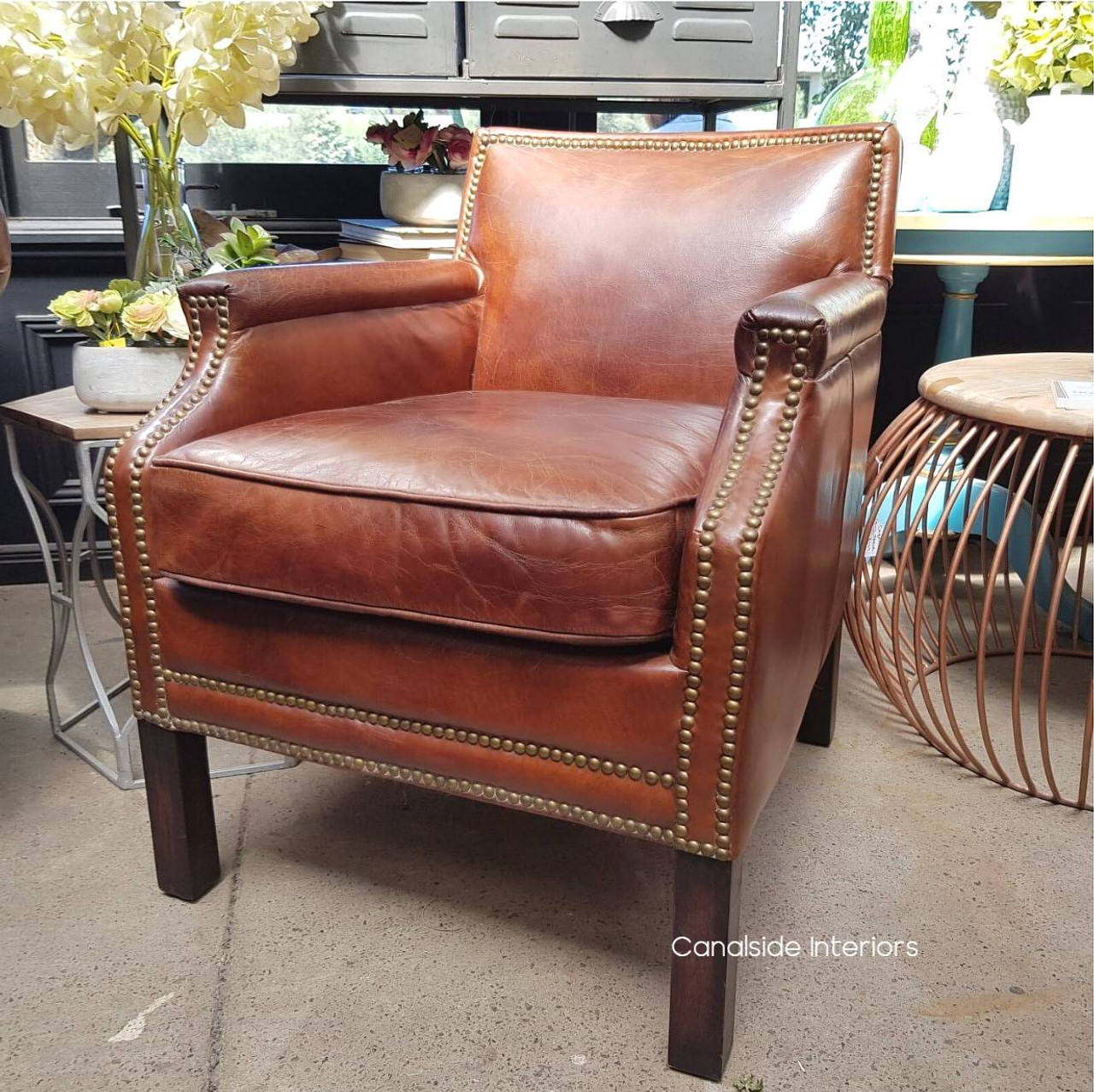 The Metropolitan armchair complementing a home office, merging sophistication with functional design.