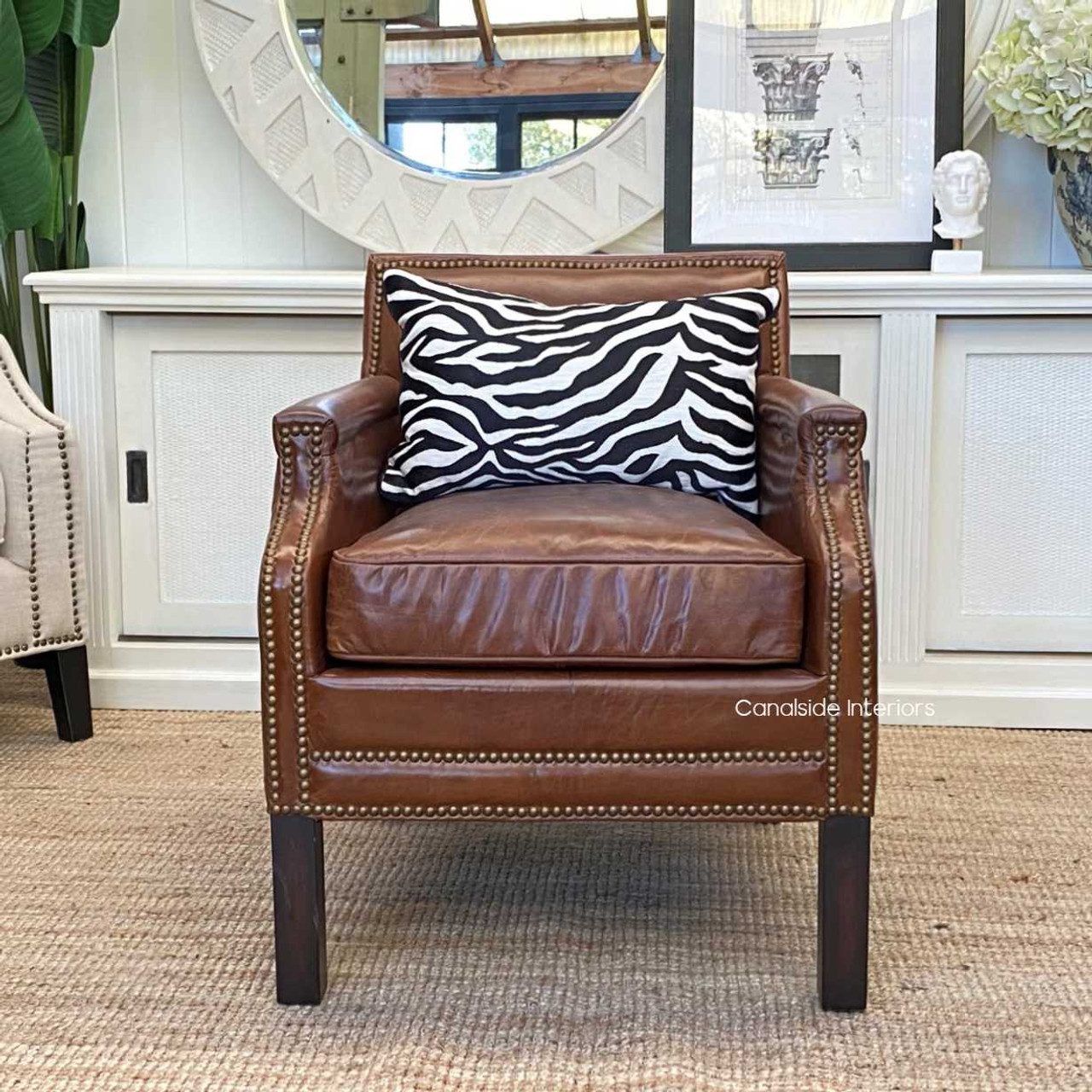 A living room scene featuring the armchair as a statement piece, enhancing the space with its classical elegance.