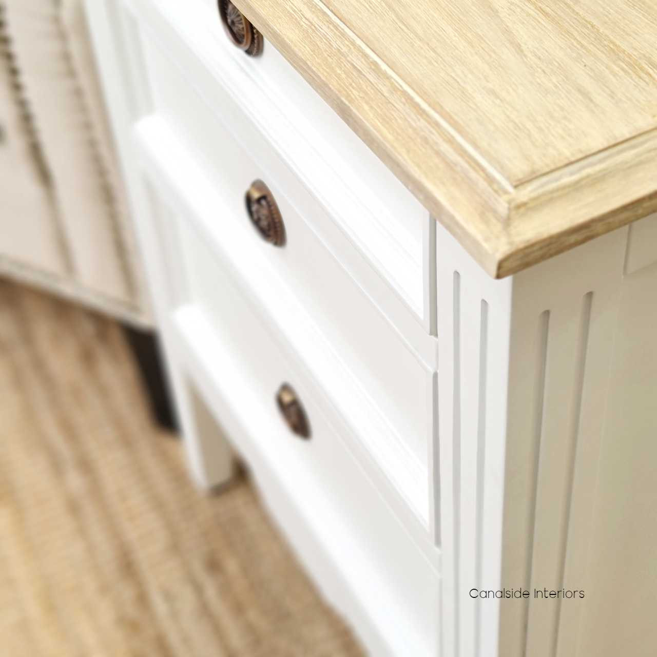 Close-up detail showcasing the minor distressing on the bedside, highlighting its traditional craftsmanship.