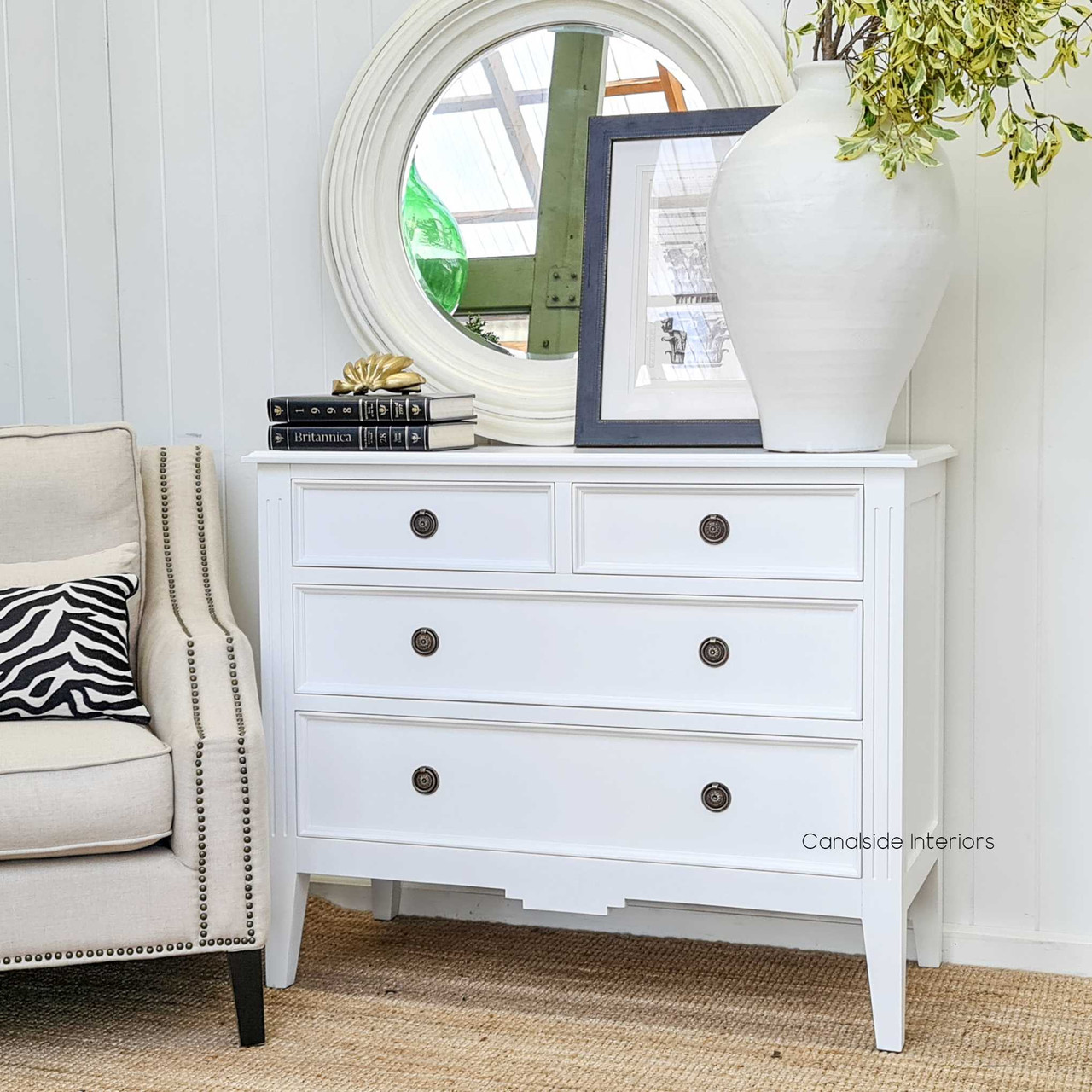 Angled shot illustrating the seamless integration of the chest in a Hamptons-style bedroom, enhancing coastal vibes.