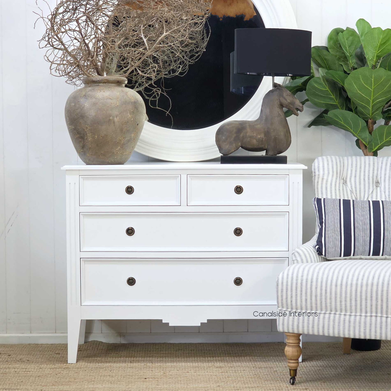 Full front-facing image highlighting the bright satin-white finish and four spacious drawers.