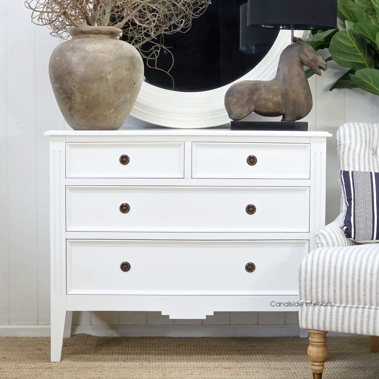 Straight-on capture of the white Peninsula chest styled with contemporary interior décor.