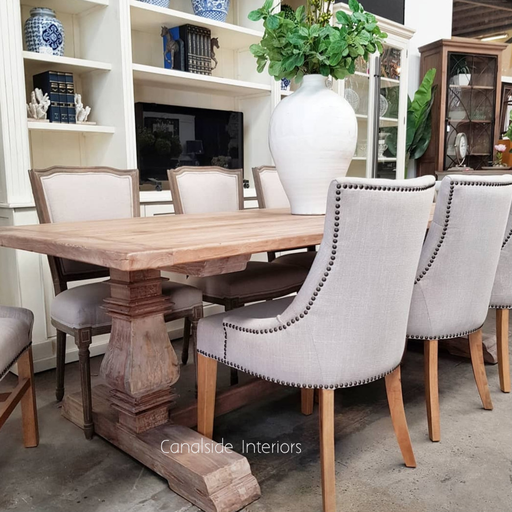 Profile shot showcasing the table's practicality and comfort as a central piece in a casual family room.