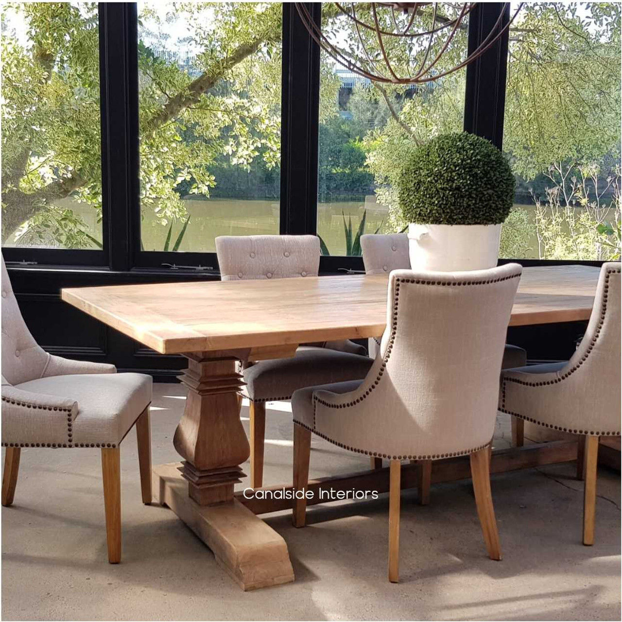 Profile view against a minimalist backdrop, highlighting the table's capacity to blend seamlessly with modern and classical interiors alike.