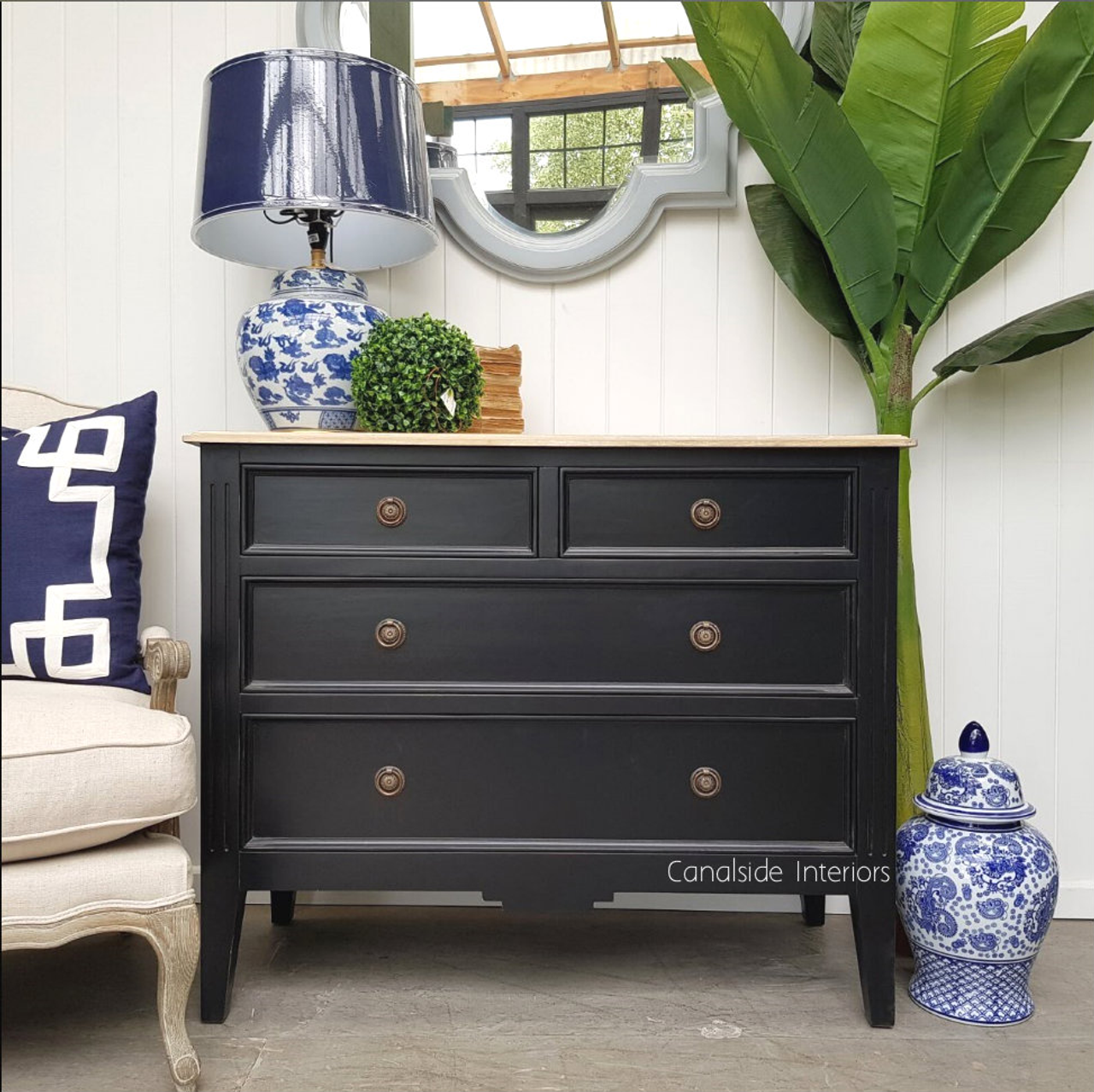 Elegant pairing of the chest with classic art and decor, proving its ability to fit into modern and traditional interiors alike.