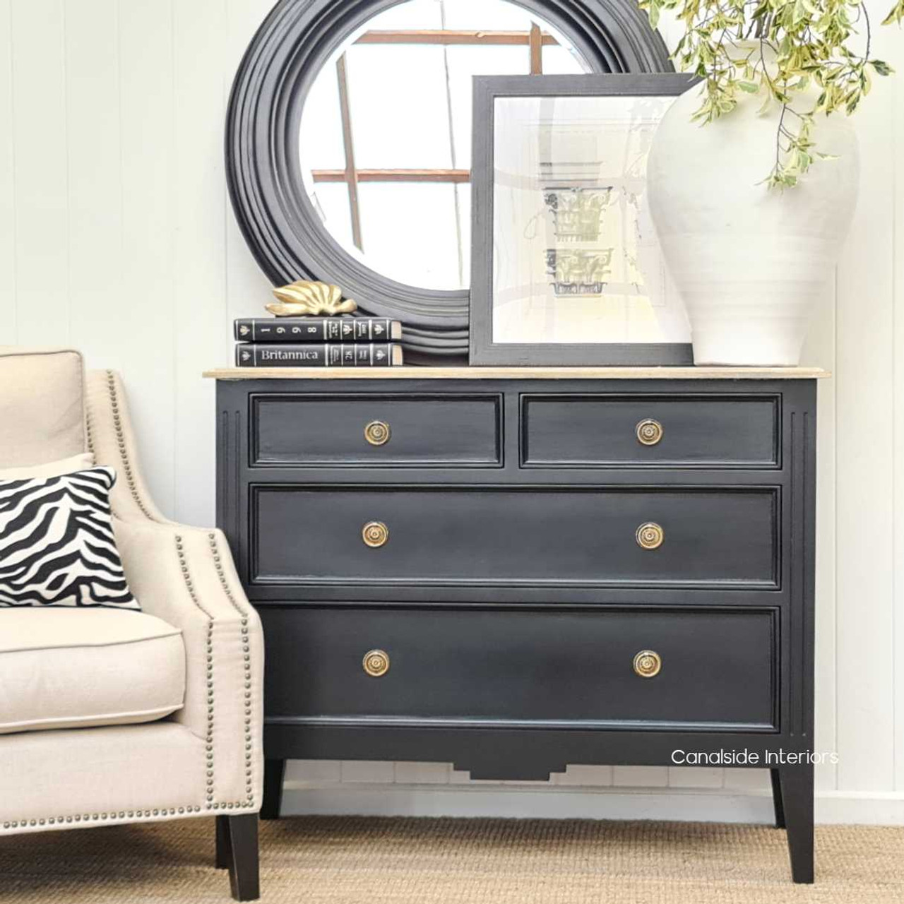 Front view of the Peninsula 4 Drawer Chest, showcasing the distressed black finish with a limewash top, ideal for Hamptons-inspired decors.