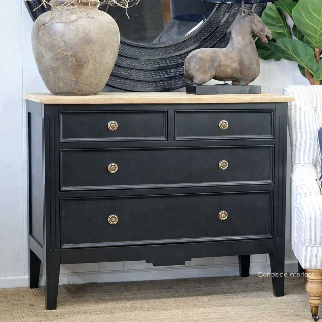 Angled view emphasising the Peninsula chest's straight lines and black with limewash finish, perfect for adding a touch of classical elegance.