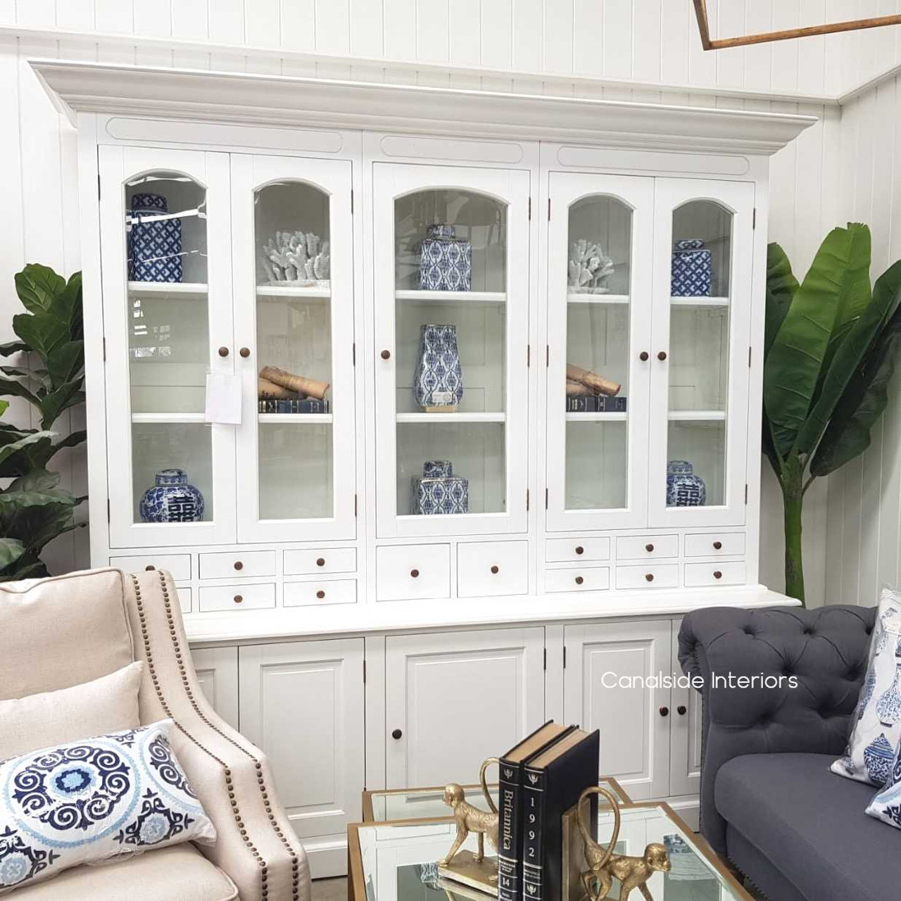 Introduce classical charm to your bedroom with the Key Largo Display Unit, featuring a minor distressed white finish for a modern touch