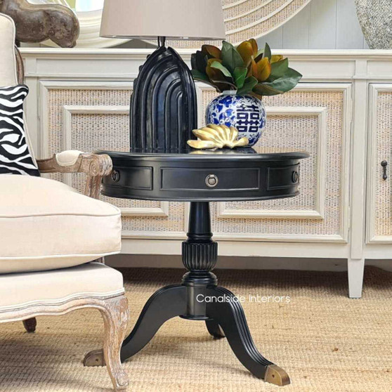 The Cobble Hill Side Table in distressed black is the epitome of timeless elegance, perfect for adding a classical touch to a Hamptons-style bedroom, brought to you by Canalside Interiors