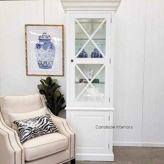 The South Hamptons 1-Door Display Unit in classic white brings a blend of modern and coastal charm to your home's decor - Canalside Interiors.