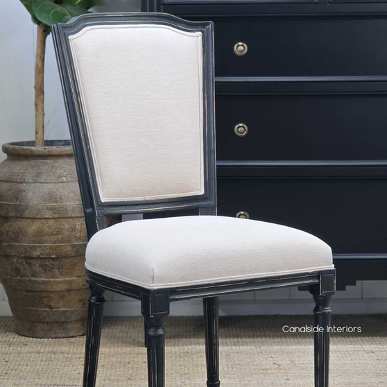 Angled close-up of the Stark Dining Chair showing the supportive backrest curve and fabric detail.