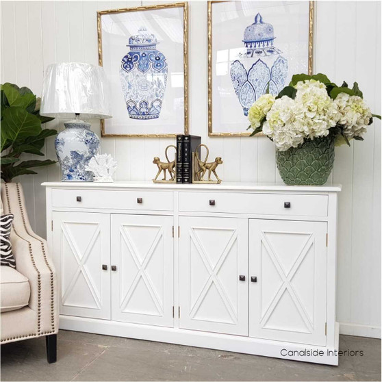 The South Hamptons 4 Door Sideboard in elegant white offers a fresh coastal charm to your dining room decor