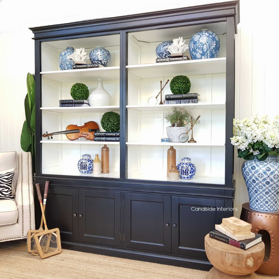 Front view of the Grange Wall Unit showcasing its elegant black exterior with a contrasting white interior.