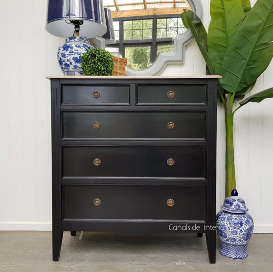 Perspective highlighting the chest's straight lines and minor distressing, marrying traditional craftsmanship with modern elegance.