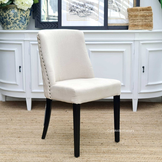 The quilted Bingley chair captured in a casual dining setup, showcasing its adaptability to various styling themes.
