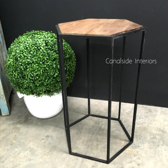 Angled perspective of the bar stool, emphasizing the unique polygonal design and wooden seat.