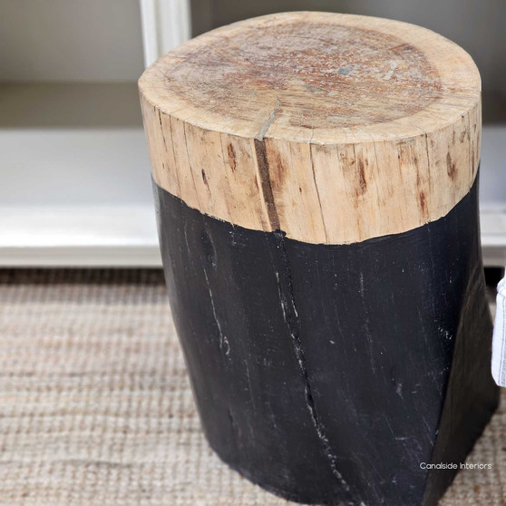 This Canalside Interiors Organic Log Trunk Stool in black offers a modern yet natural touch for a contemporary bedroom setting