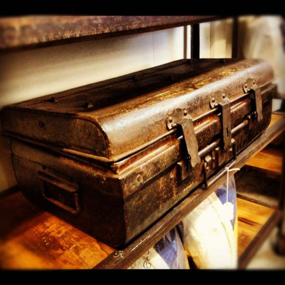 Distressed Vintage Metal Trunks from Canalside Interiors, ideal for adding a touch of rustic charm to a Hamptons-style bedroom