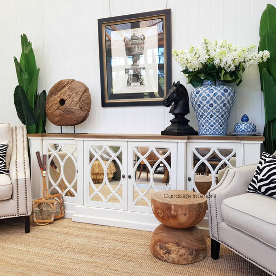Front view of the Marielle Mirrored Sideboard in stone with heavy distressing and a weathered oak top, showcasing its unique circular overlay pattern on aged mirrored doors.