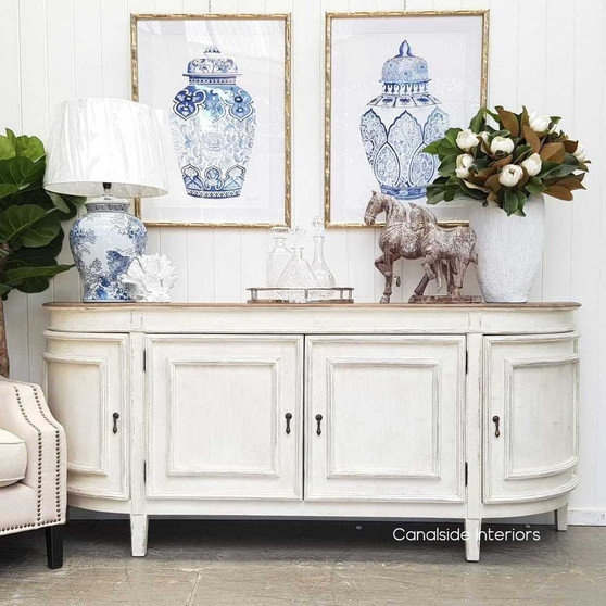 The Francia Sideboard from Canalside Interiors, with its stone finish and weathered oak top, provides a classical yet modern elegance perfect for a Hamptons-style bedroom