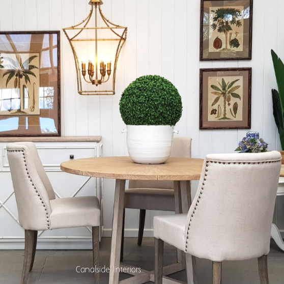 A pair of Bingley Chairs framing a contemporary dining table, merging modern and classical decor elements.