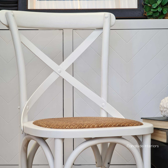 Elegant Distressed White Cross Back Chair evoking Hamptons sophistication, ideal for dining room luxury - Canalside Interiors