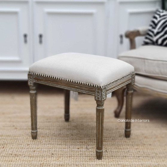 Detailed close-up of the Caylee Ottoman showcasing the intricate stud work, adding a timeless coastal charm to any lounge room - Canalside Interiors.