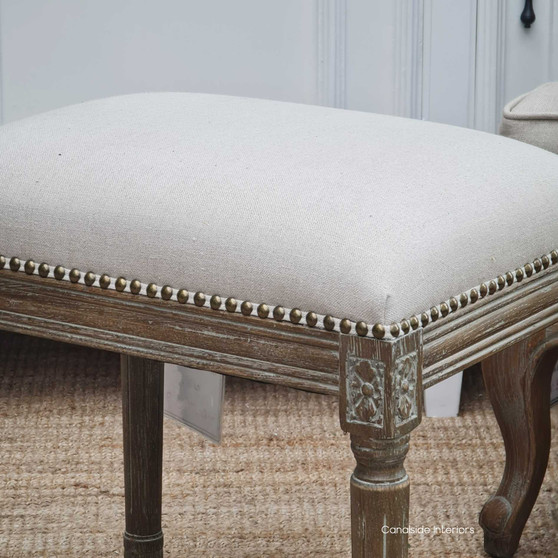 Detailed close-up of the Caylee Ottoman showcasing the intricate stud work, adding a timeless coastal charm to any lounge room - Canalside Interiors.