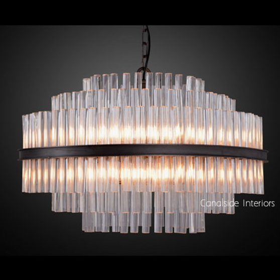 The chandelier casting a warm, inviting glow over a sophisticated living room, emphasizing its compatibility with dimmer switches.