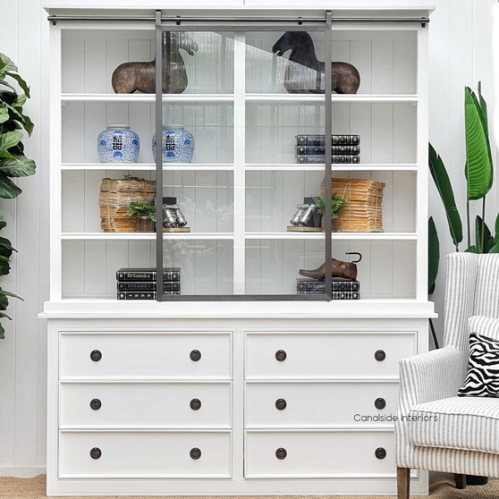 Front view of the Pemberley Sliding Door Display Wall Unit in Distressed White, embodying classic Hamptons elegance.