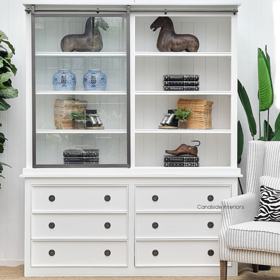 Front view of the Pemberley Sliding Door Display Wall Unit in Distressed White, embodying classic Hamptons elegance.