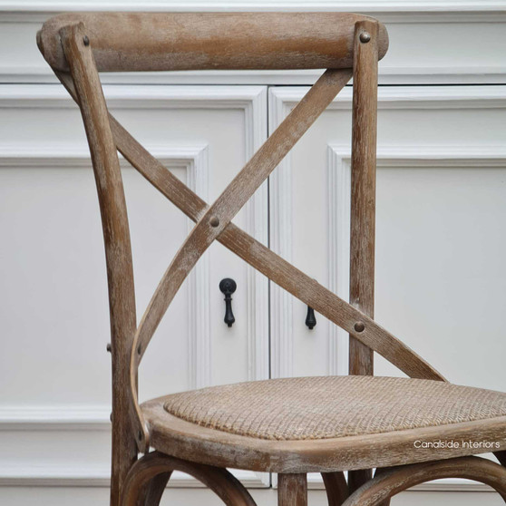 Distressed Oatmeal Cross Back Chair by Canalside Interiors, an embodiment of Hamptons style, perfect for coastal bedroom settings.