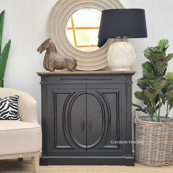 The sideboard's footprint in a entryway setting, serving as a statement piece that combines functionality with aesthetic charm.