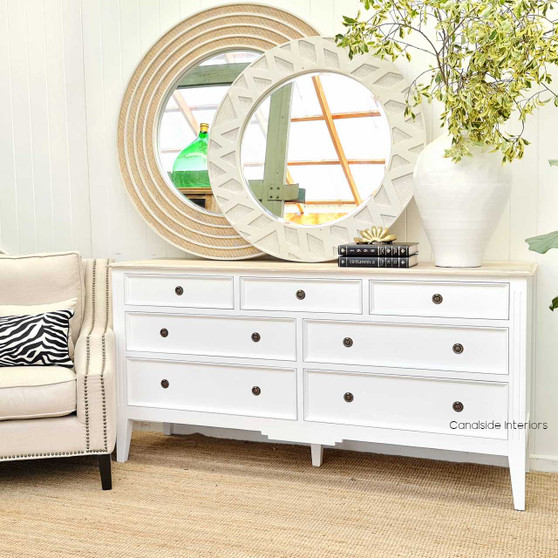 Elegant frontal view of the Peninsula 7 Drawer Chest, showcasing its white finish and limewash top in a Hamptons-style interior.