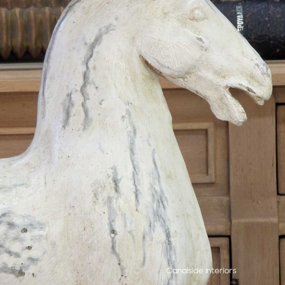 View of the Ancient Equestrian Table Lamp at Canalside Interiors, showcasing its Distressed Stone finished horses, taupe lamp shade and distressed black base.