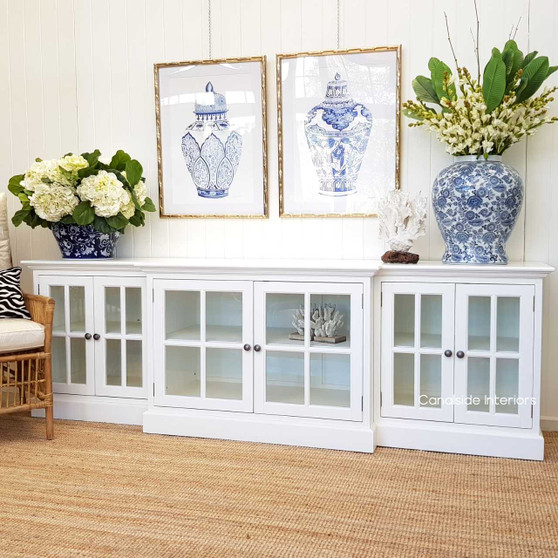 Front view of the white Casement Sideboard with glass doors, showcasing the elegant, stepped front detail.