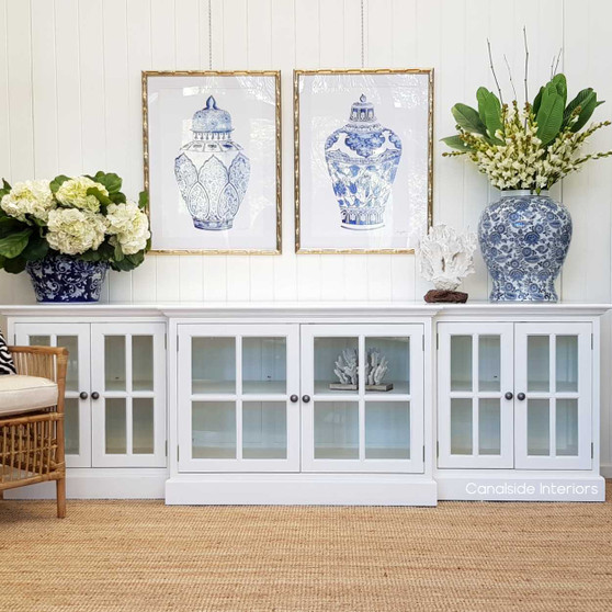 Front view of the white Casement Sideboard with glass doors, showcasing the elegant, stepped front detail.