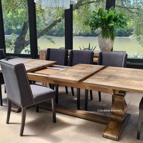 Frontal view of the Provence Parquetry Dining Table in its compact form, showcasing the intricate parquetry top and elegant white cedar base.