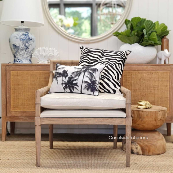 Angle shot capturing the plush cream seat and back cushion of the Palmer Plantation Armchair, offering comfort and style in a living room setting.